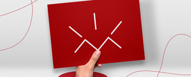 Mão saindo de um buraco vermelho segurando um modelo de panfleto. Conceito.